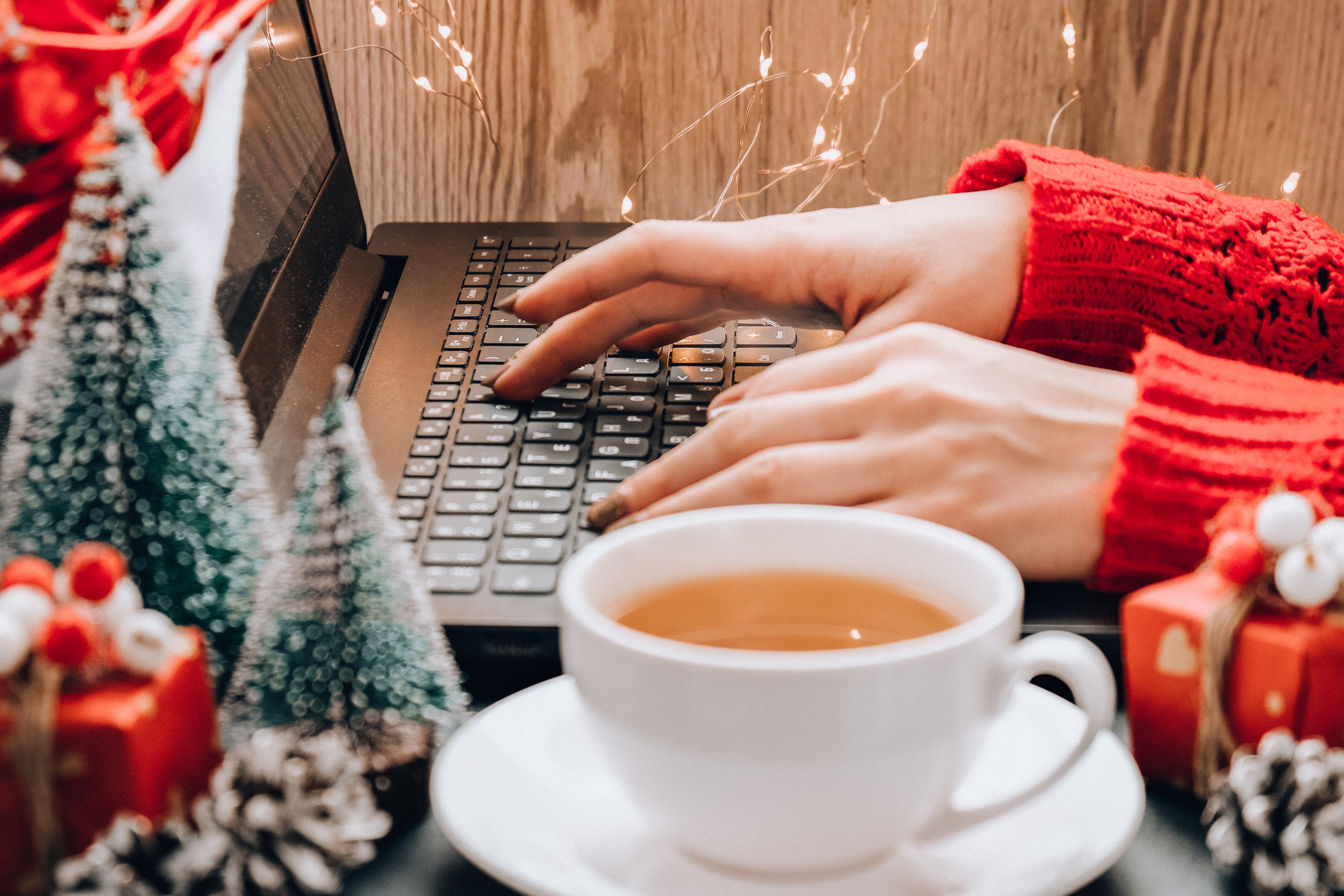 woman with notebook computer shopping online for holiday gifts